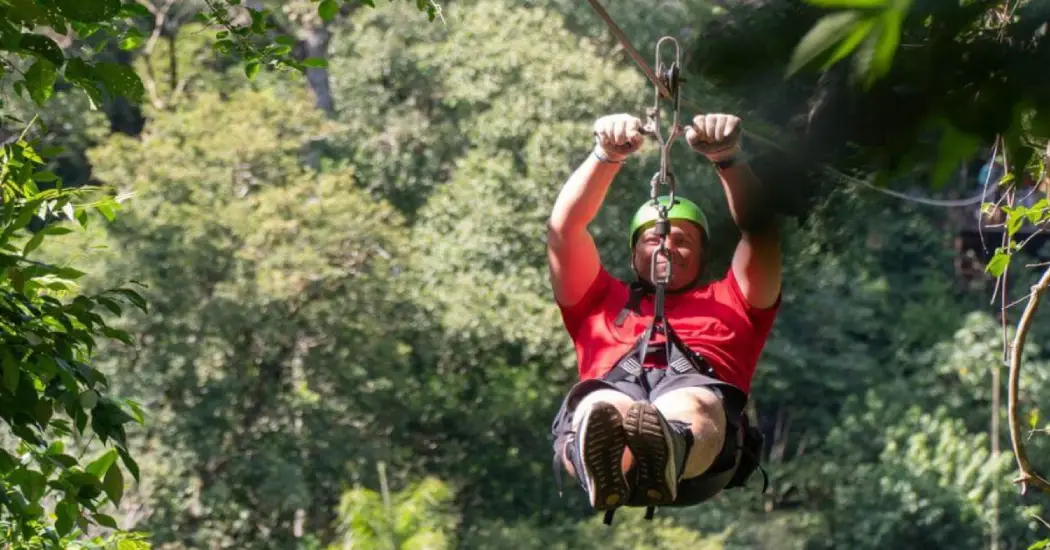 A tourist doing adventurous activities in the Iguazu Falls