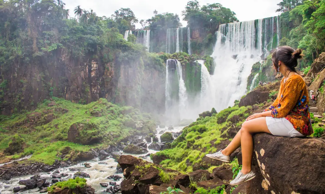 A woman enjoying her private tour to the Iguazu Falls