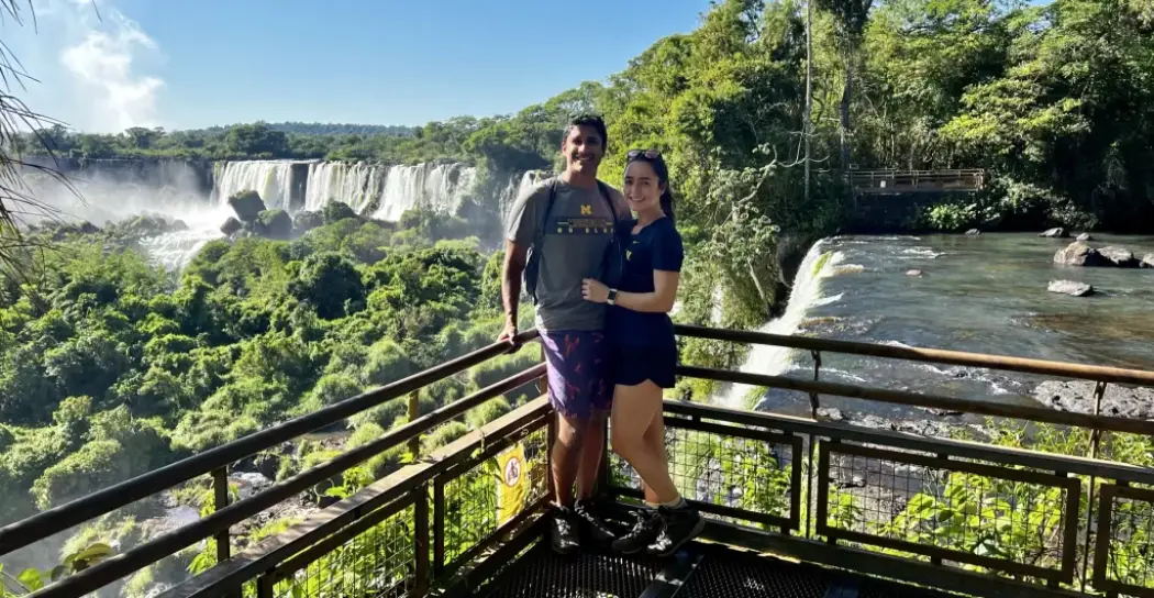 A couple posing on the Upper Circuit in the Iguazu Falls